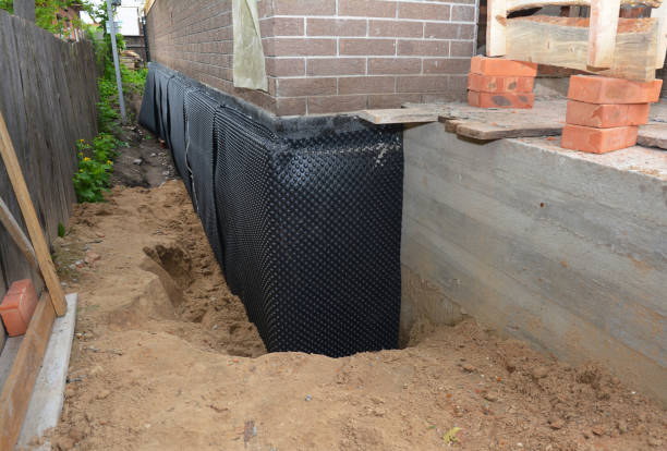 Happy homeowners after waterproofing job in Ridgewood